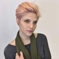 Voluminous Brushed Up Pixie With Messy Blowout Texture And Baby Pink Hair Color The Latest Hairstyles For Men And Women 2020 Hairstyleology Baby Pink Hair Hair Color Pink Pixie Hair Color
