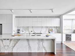 Homcom modern kitchen buffet with hutch pantry storage, microwave counter, 2 cabinets, and adjustable shelves, grey. Bright Spacious Kitchen With Smooth White Cabinets Dark Brown Floor White Kitchen Island Gray And White Kitchen White Modern Kitchen Modern Kitchen Design
