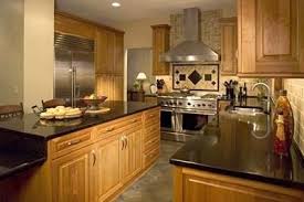 Backsplash With Dark Countertops Black Granite Countertops And Maple Cabinets And Entert Trendy Kitchen Tile Transitional Kitchen Design Kitchen Tiles Design