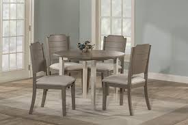 Antique beeswax extendable dining table this antique dining table can be extended to accommodate up to four people with its butterfly leaf a rustic take on a traditional round dining table with a leaf extension to make it longer when needed. Amazon Com Hillsdale Furniture Round Drop Leaf Table 5 Piece Dining Set Sea White Table Chair Sets