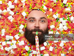 Woman Cover Under A Lot Of Colorful Candy Stock Photo