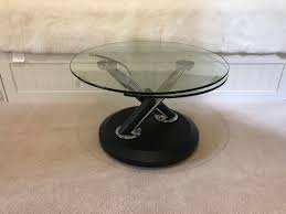 Its tempered glass top sits atop four sleek rounded legs, which in turn sit atop white manufactured wood legs, with a tempered glass lower shelf perfect for hosting extra magazines or. Rent Tokyo Rotating Glass Coffee Table Modern Space Saving In Linlithgow Rent For 0 00 Day