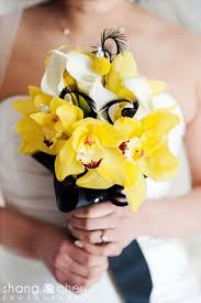 Beautiful Black And Yellow Flowers This Beautiful Modern Yellow And White Bouquet Consists Of Yellow Cymbidiums White Calla Lilies Yellow Wedding Bouquet Yellow Wedding Flowers Yellow Wedding