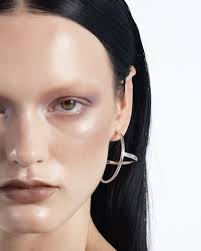 Lily Collins wearing MAM ORBIT hoops and CASA BATLLÓ ring in the new season  of Emily in Rome.