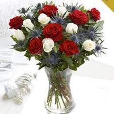 If you cannot be with friends and relatives this christmas why not send a festive table decoration. Christmas Rose Hand Tied Flowers Delivered Edinburgh Flower Shop Flowers Buy Delivery