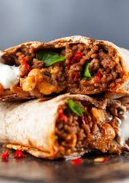 To make these smothered burritos, simply brown ground beef with some diced onion and season with a packet of taco seasoning. Recipe Healthy Beef And Bean Burritos The Movement Standard