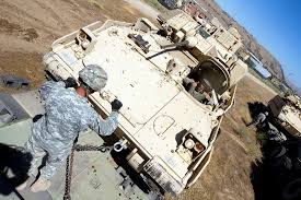 Bradley driver, Spc. Aaron Spielman, 1-185 Armor, works