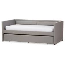 This daybed is upholstered in a navy polyester and sits upon a navy metal frame, loudly punctuated by brass screws at its junctures. Daybeds Furniture Sale Target