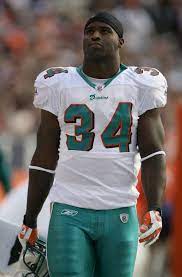 Denver November 02 Running Back Ricky Williams 34 Of The Miami Dolphins Awaits Action Against The Denver Bronc Ricky Williams Nfl Players American Football