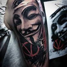 This piece is for people who are bold enough to ink daring tattoos. Remember The 5th Of November With These Guy Fawkes Mask Tattoos Vendetta Tattoo Mask Tattoo V For Vendetta Tattoo