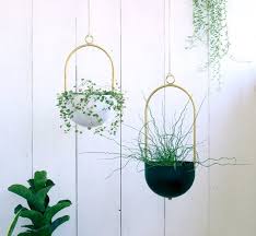 Indoor wall planters and hanging pots are both great ways to incorporate plant life into your home without having to take up any table or space. Beautiful Metal Plant Displays For Small Air Plants Find More Great Ideas On The Blog Arrival Departu Hanging Planters Hanging Planters Indoor Hanging Plants
