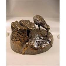 They are crafted of bronze with a silver finish. Bronze Kiwi Bird Card Stand 1737808