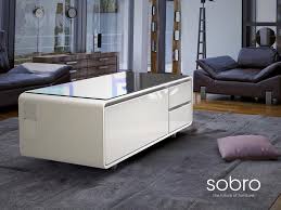 This piece is a coffee table by day, but at night, its top can be raised ten inches to create a standing bar table, while its base transforms into a party cooler! Sobro Cooler Coffee Table The Coolector