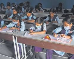 students studying in a classroom in India