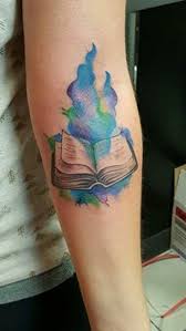 Magical Book Tattoo Design Magical Book Tattoo Design Is Inspiration For All Those People Who Believes In Magic Book Tattoo Tattoos Tattoo Designs