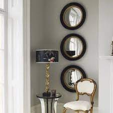 Aside from making spaces appear larger, wall mirrors offer a tactful, stylish way to hide imperfections, maximize light, and provide a second look at your favorite accents. Dressing Your Space With Porthole Mirrors Mirror Wall Mirror Decor Mirror Wall Decor