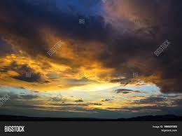 Silhouette of tree near body of water during beautiful sunset. Sunset Sky Background Image Photo Free Trial Bigstock