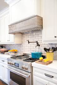 Installing a kitchen hood in wood cabinetry requires some time, tools, and a helper. Custom Vent Cover Made From Reclaimed Barn Wood From Local Tennessee Farm In Remodeled Kitchen Hgtv