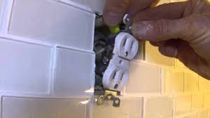 Tape off the existing countertop or backsplash and the underside of the cabinets to protect those surfaces. How To Extend Electrical Outlets Over Tile Youtube