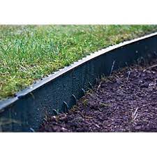 Untidy lawn edges, where the grass is growing into the surrounding borders, are easy to correct. Green Lawn Edging Tile 1m Wickes Co Uk