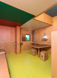 The Built In Table And Stools Were Crafted From Used Whiskey Crates The Overhead Cabinets Provide Additional Storag Le Corbusier Corbusier Colour Architecture