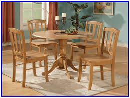 The chairs feature vertical slat backs, while the round table. 71 Reference Of Small Round Kitchen Table With 4 Chairs Small Kitchen Tables Kitchen Table Oak Solid Wood Dining Chairs