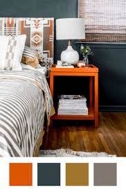 Teal midcentury modern style chairs with a dark wood feature wall. Colors That Go With Orange How To Make Them Work Apartment Therapy