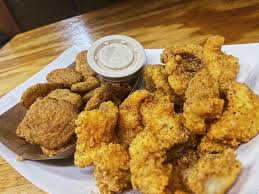 Serve with a tangy sauce and coleslaw for adults. Big Johnz Bbq Cajun Catfish Nuggets Cajun Catfish Nuggets Come With One Side Of Your Choice Get Any Regular Side Item Or White Beans And Hush Puppies With This