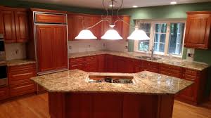 Typhoon bordeaux granite is a dramatic durable granite of golds and beiges with deep golden veins. Typhoon Bordeaux Granite With Cherry Red Cabinets Kitchenremodel Typhoonbordeaux Granitekitchen Kitchen Remodel Granite Kitchen Red Cabinets