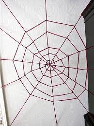 First you want to start with a basic frame of one vertical length of yarn and one horizontal. Giant Yarn Spider Web Hgtv