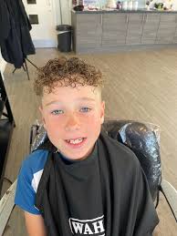 Meet this happy young lad, rocking his brand new curly hair with confidence  and style! 🌟 His curls are bouncing as high as his spirits, and he's  loving every moment of his