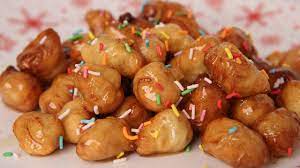 In a frying pan large enough to fit all of the struffoli, pour in the honey and sugar and mix for about a minute over a medium/high flame. Struffoli Or Cicerchiata Laura In The Kitchen Everybodylovesitalian Comeverybodylovesitalian Com