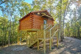 These lovely and simple timber structures stand on pillars and have their ground floor elevated. Whispering Pines Log Cabin On Stilts