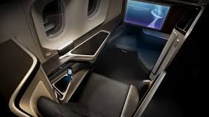 To the side of the seat was an enclosed compartment (perfect for storing glasses, a passport, and/or a phone), which also had a mirror. British Airways New Boeing 777 First Class Suites With Privacy Doors Executive Traveller