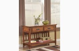 You'll love the extra room in the cubby and lower cabinet for stashing items. Cross Island Lift Top Cocktail Table From Ashley T719 9 Coleman Furniture