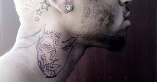 Getting a sick new piece done on the side of his neck. Chris Brown Draws Heat From New Neck Tattoo Chris Brown Neck Tattoo Chris Brown Tattoo Neck Tattoo