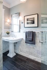 The Smooth Lines On The Dark Wood Flooring Pair Beautifully With The Marble Wall Tiling In This Tra Marble Tile Bathroom Traditional Bathroom Marble Wall Tiles