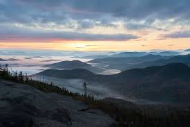 It is one of six mountains surrounding saranac lake. Light At The Top Ray Palmer Photography