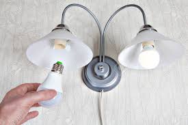 Replacing The Electric Light Bulbs In A Household Wall Lamp Stock Photo Picture And Royalty Free Image Image 53455048