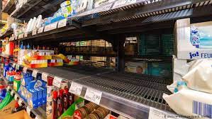 A situation in which many people suddenly buy as much food, fuel, etc. German Supermarkets Report Coronavirus Panic Buying News Dw 01 03 2020