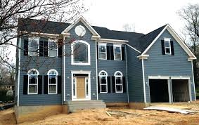 White spanish house featuring a blue front door and black shutters. Slate Blue House With Black Shutters Novocom Top
