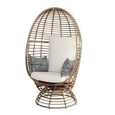 stylewell brown wicker outdoor swivel patio egg lounge chair with beige cushions and black cream pattern pillows frs50006b br the home depot beige cushions egg chair lounge chair outdoor