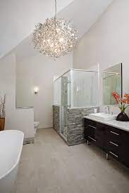 The Vaulted Ceiling And Contemporary Chandelier Really Make A Statement In Thi Master Bathroom Renovation Modern Bathroom Design Contemporary Bathroom Designs