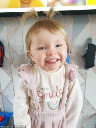 Lesbian couple say their baby is 'lucky to be alive' after a rock was  thrown through their window