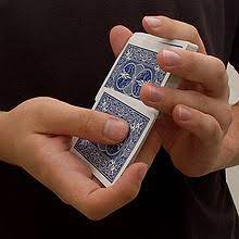 The most common shuffling technique is called a riffle, in which half of the deck is held in each hand with the thumbs inward, then cards are released by the thumbs so that they fall to the table intertwined. Shuffling Wikipedia