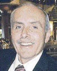 Longtime Grand Blanc barber Kirk Reid doled out clips and conversation