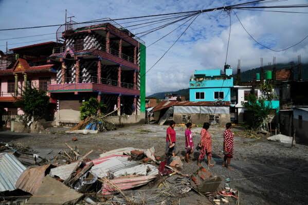 Flash floods in Nepal and China kill at least 359 and leave over 1,400 missing, with people from more than 30 countries unaccounted for