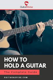 How to hold the guitar while standing for those of you who prefer to stand and play the guitar, you need to stand straight and pick the guitar up and hold it in a way that the back of the guitar touches your stomach or chest area. How To Hold A Guitar The Complete Guide Guitar Advise