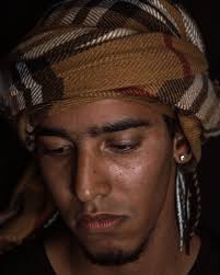 Cheerful black man standing in field · Free Stock Photo