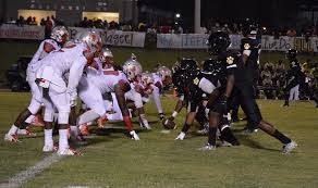 TROJANS WIN OT THRILLER OVER TIGERS